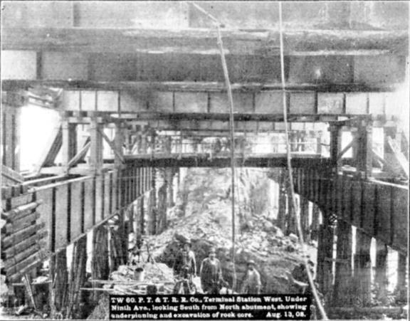 Plate XLIX, Fig. 1.— TW 60, P.T. & T.R.R. Co. Terminal Station West. Under Ninth Ave., looking South from North abutment, showing underpinning and excavation of rock core. Aug. 13, 08.