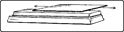 Fig. 154. Sharpening a Cabinet-Scraper: 2nd Step, Whetting.