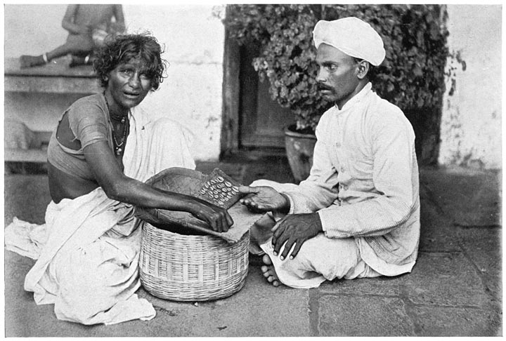 Korava Woman Telling Fortune with Cowry Shells in Tray.