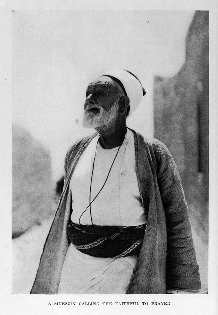 Photograph: A MUEZZIN CALLING THE FAITHFUL TO PRAYER